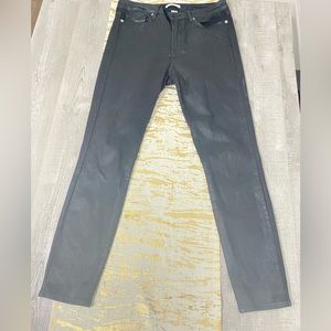 Good American coated black skinny jeans